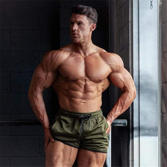 Bodybuilder wearing Allrj 80's old school shorts - Allrj